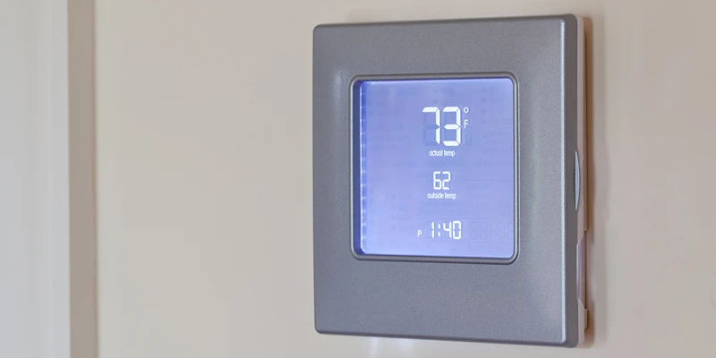 Wall thermostat reading 73 degrees Fahrenheit