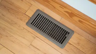 Closed air vent in hardwood floor