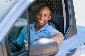 Smiling Aire Serv tech in van.