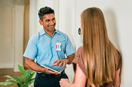 Smiling AirServ tech with customer.