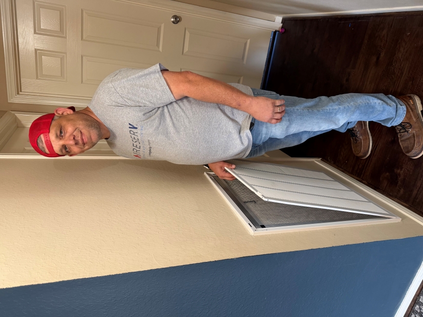 Technician Replacing an Air Filter