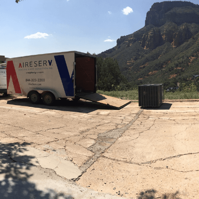 Aire Serv van with AC unit outside
