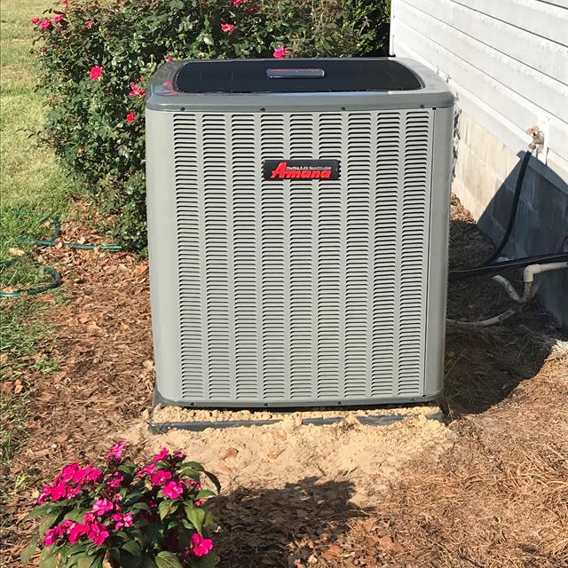 Clean Amana Air Conditioning Unit Installed Outdoors