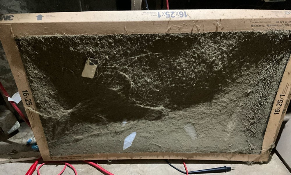 Furnace filter is heavily loaded with dust and debris