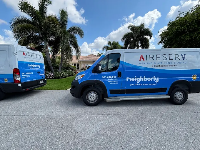 Two Service Trucks Parked Outside A Florida Home