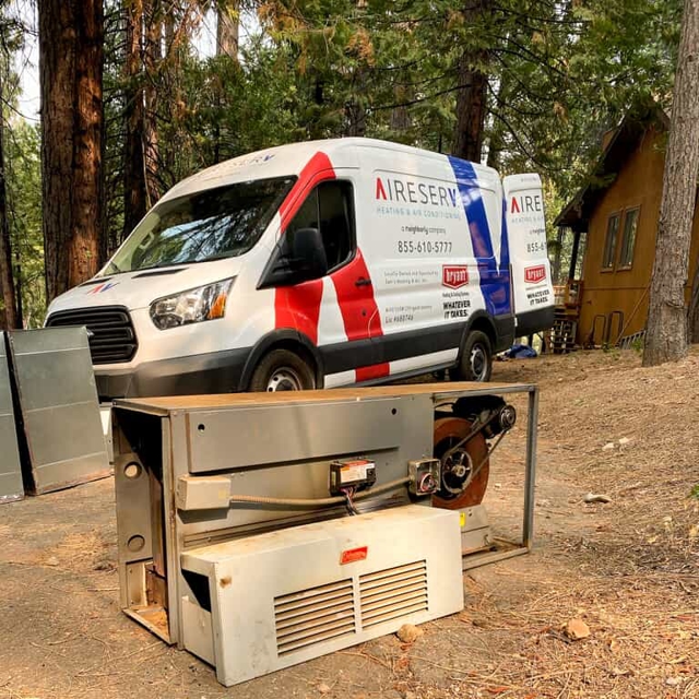 Aire Serv van at a cabin performing emergency HVAC service