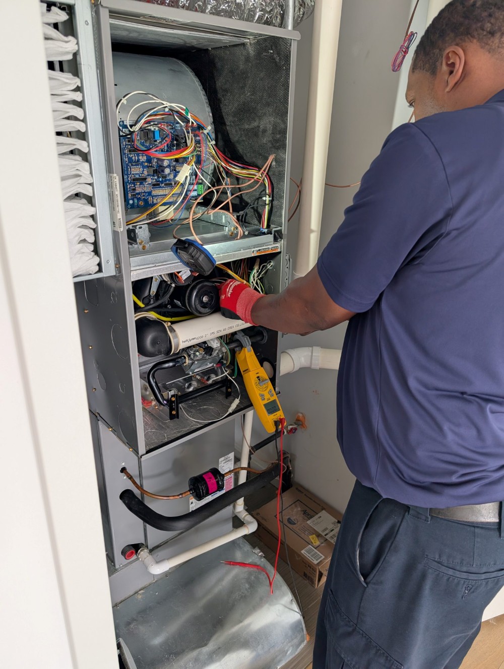 HVAC tech working on a system