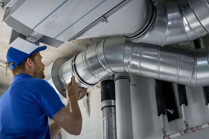 Service Tech Working On Air Ducting