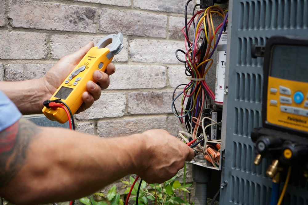 HVAC tech working on a system