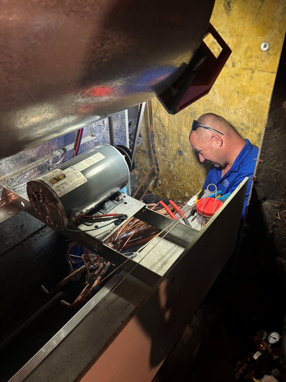 Tech working in attic