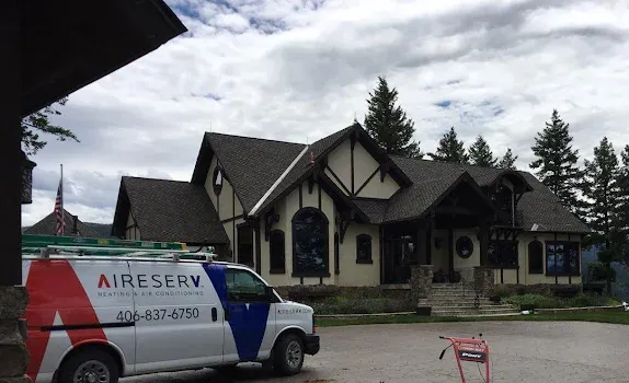 Aire Serv of Missoula service truck parked outside a residential home.
