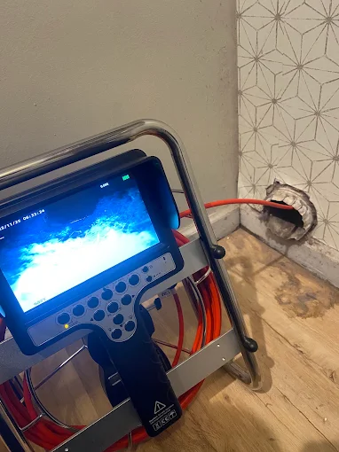 Technician Using a High-Definition Video Camera to Inspect a Dryer Vent Aire Duct