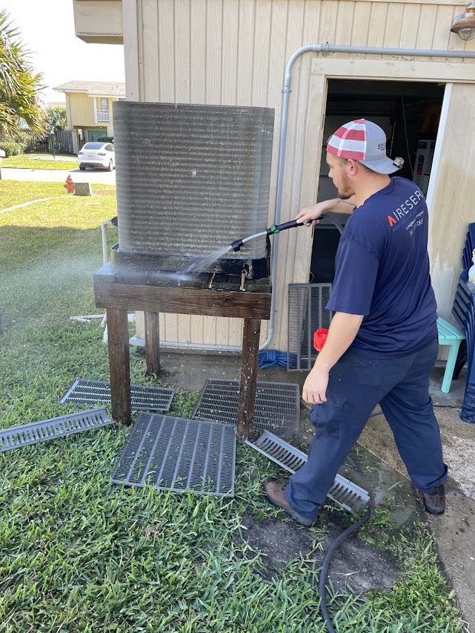 Jose cleaning out door system at maintenance call