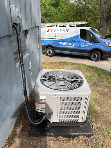 Top of New Outdoor unit with Van in the Background