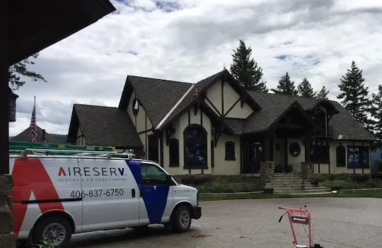Aire Serv of Kalispell service truck parked outside a residential home.