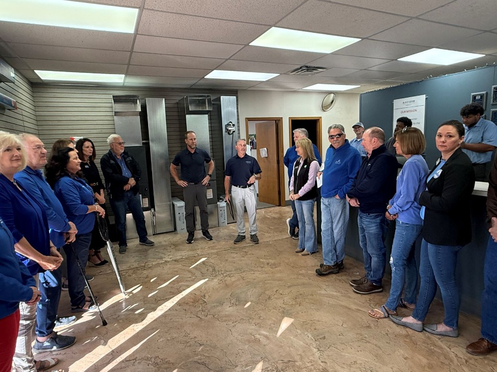Owners speaking at an office gathering