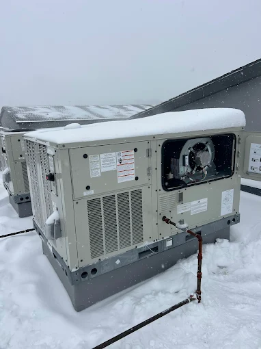 Outdoor HVAC Unit Covered in Snow