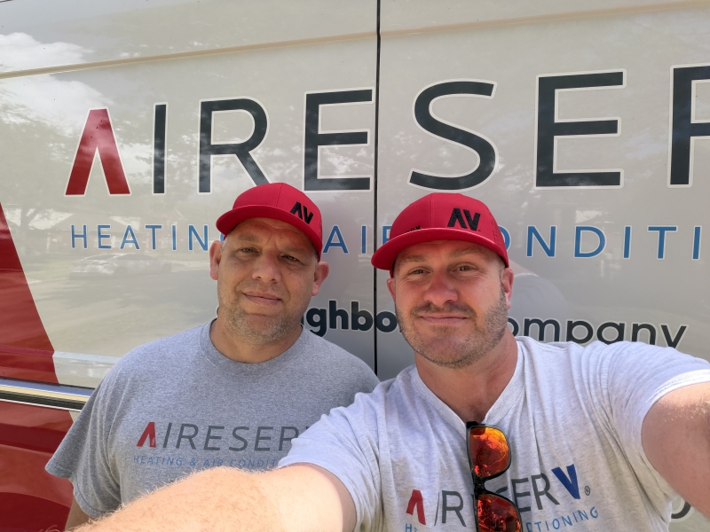 Owner and Technician Together Infront of Aire Serv Van