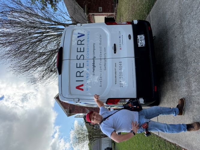 Technician Posing Next to Company Van