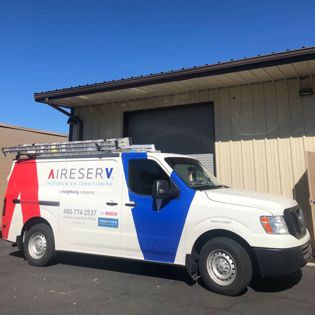 Aire Serv service truck parked outside a warehouse building in East Valley, Arizona