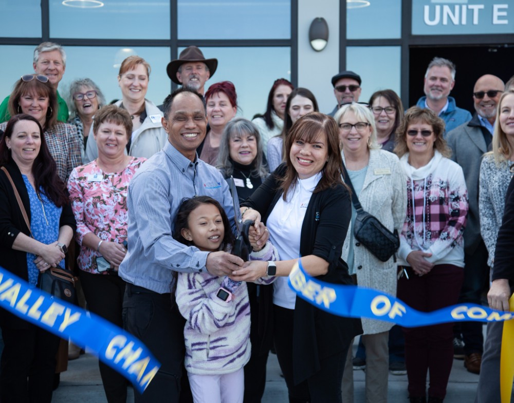 Aire Serv of Front Range team participating in a Chamber of Commerce ribbon-cutting event.
