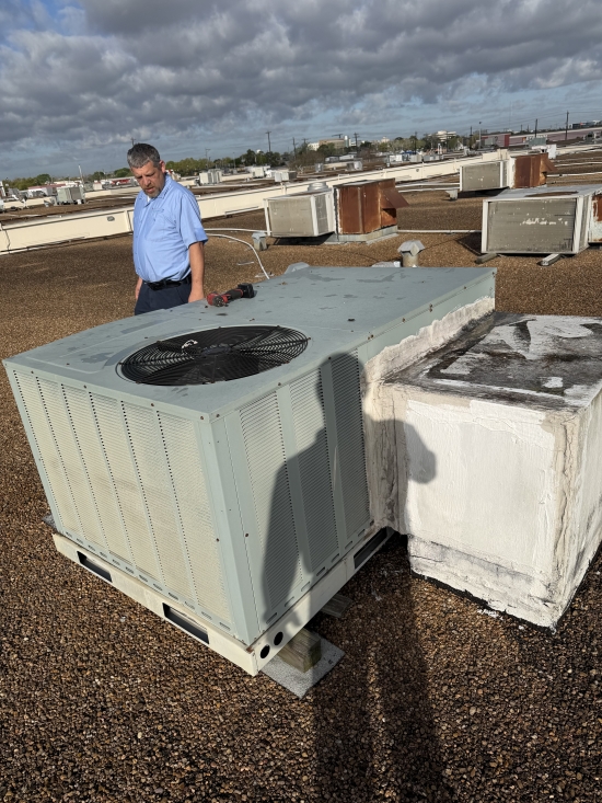 Technicians Working On a Commercial HVAC System Installation on a Rooftop