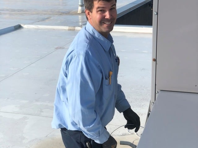 Smiling technician