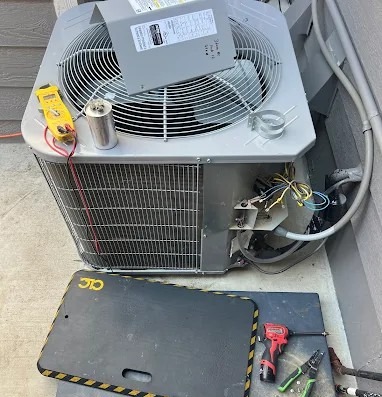 Aire Serv technician working on an outdoor HVAC unit.