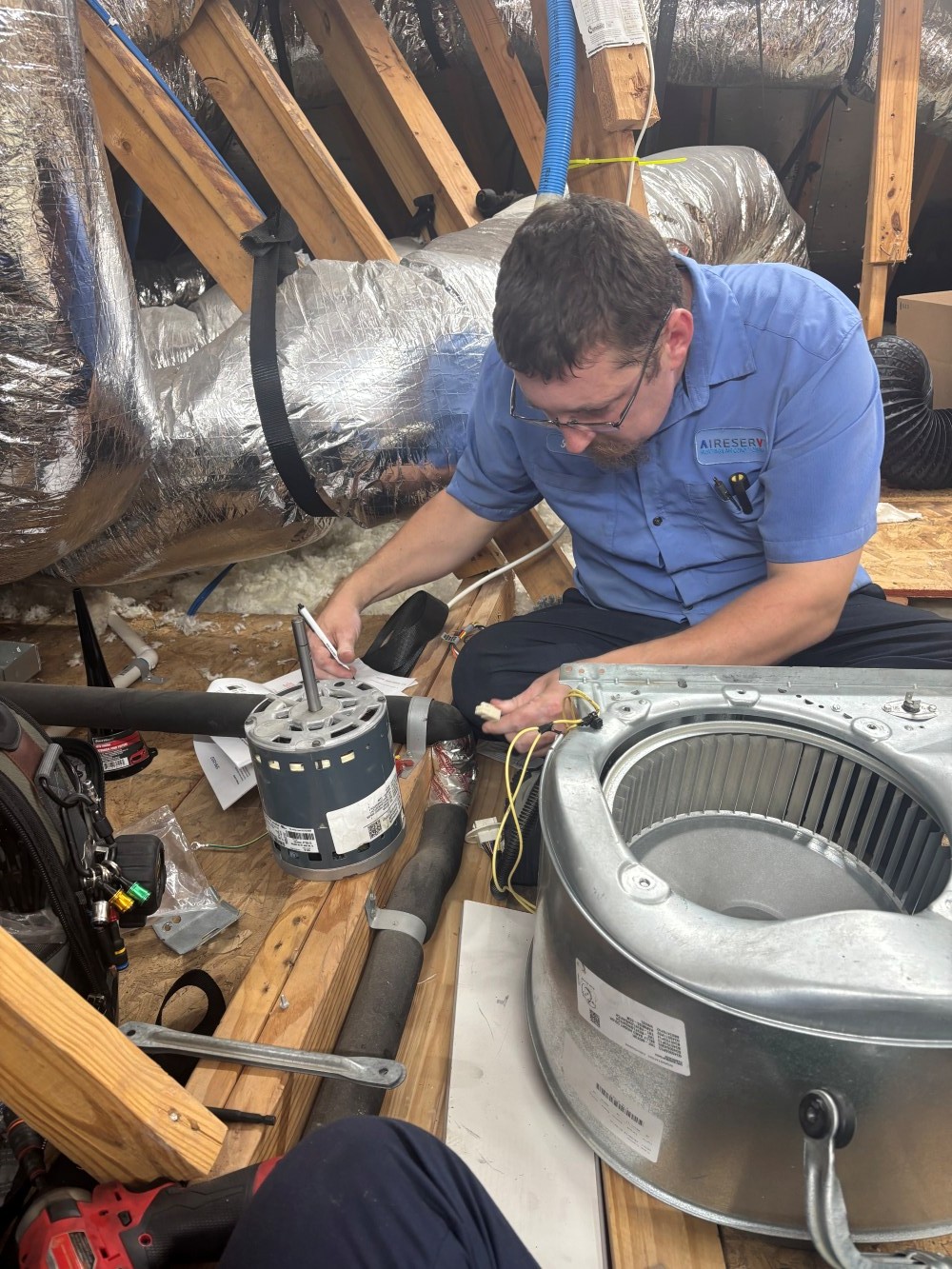 Tech Working on Repair Project