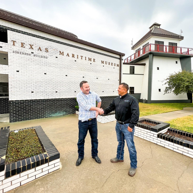 Customer Shaking Hands With Aire Serv Employee Owner