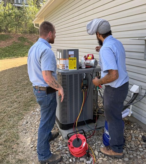 Two Technician's Working On A System