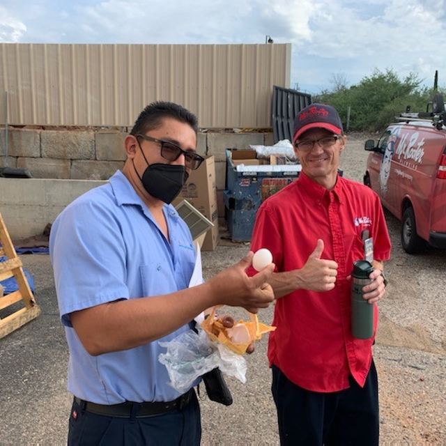 technician holding an egg