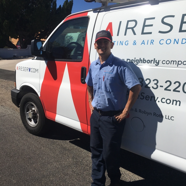 technician in front of truck