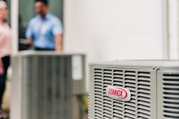 Technician performing air conditioning installation at a Fort Lauderdale home for Aire Serv customers.