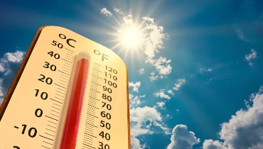 A thermometer in the foreground displays a temperature of over 100 degrees Fahrenheit as the sun blazes down. | Aire Serv of Citrus County