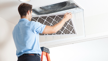 HVAC professional cleaning air return | Aire Serv of Jackson