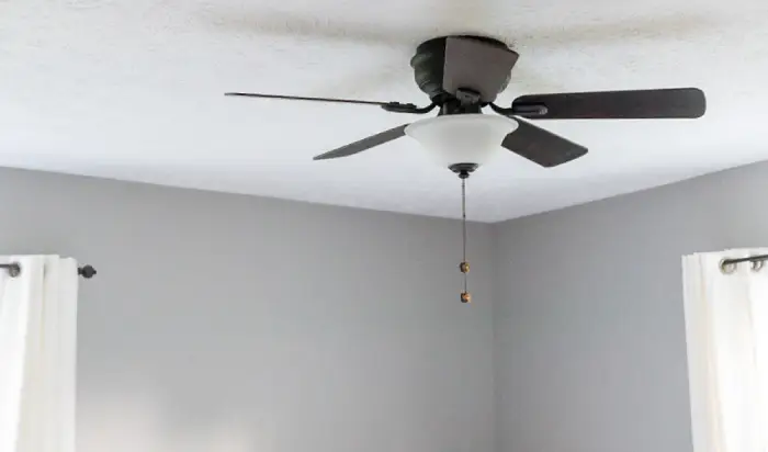Ceiling fan in grey room