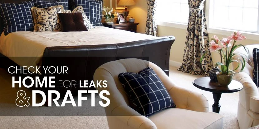 Bedroom with text: "check your home for leaks & drafts"