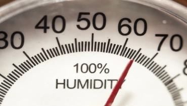 A close-up of a hygrometer that reads 65% humidity. | Aire Serv of Jackson