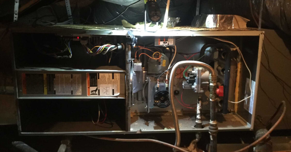 An interior view of a residential furnace in Dallas as it is being serviced with an annual furnace tune up.