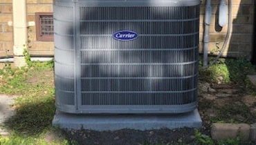 Carrier Cooling System Installed Outside The Home