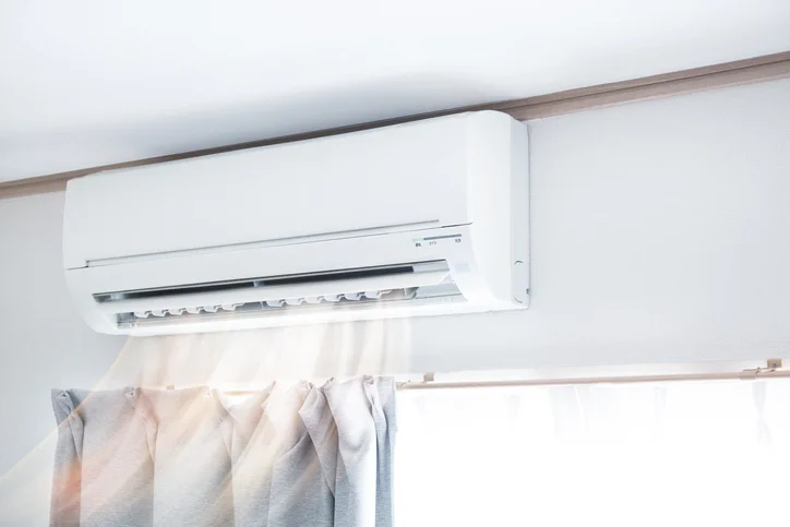 A ductless mini-split system blows air into a home. | Aire Serv of North Central Arizona