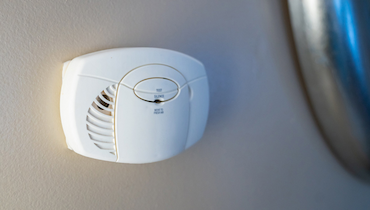 Close-up of wall mounted carbon monoxide detector.