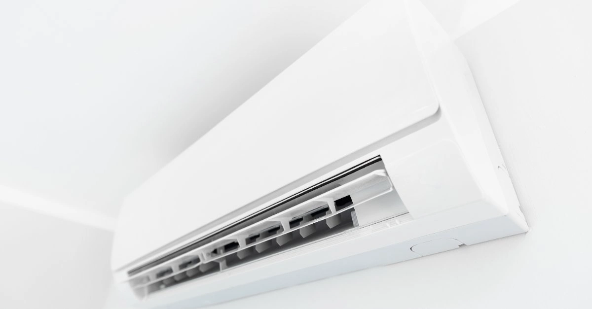 A close-up of a wall-mounted air conditioning unit installed inside a home during an appointment for air conditioner replacement in Pittsburgh, PA.