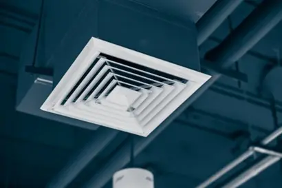 A vent on the ceiling of a commercial facility